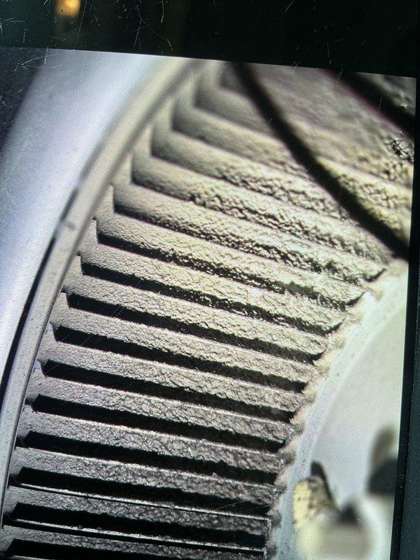Responded to service call for 15-year-old central air conditioning unit experiencing short cycling and shutting off after few seconds of operation. Upon inspection, discovered severely restricted airflow due to heavily clogged return air filter and dust-laden evaporator coil, along with extensive ice buildup on suction line and evaporator assembly. Removed frozen filter, allowed system to thaw completely, and cleaned evaporator coil. Verified proper refrigerant charge, confirmed compressor operation, and tested system startup sequence. Unit now operating normally with proper airflow and no short cycling issues.