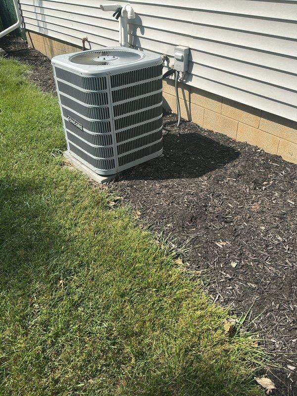 Responded to customer complaint of air conditioner not cooling adequately. Upon arrival, performed comprehensive system evaluation of 11-year-old outdoor condensing unit and 13-year-old furnace with air handler located in basement. Conducted visual inspection of exterior condenser unit, noting proper installation clearances and electrical disconnect box mounting. Inspected refrigerant line connections running along exterior wall and verified secure mounting brackets. Evaluated condensing unit for debris accumulation, fin condition, and proper pad placement. Proceeded to basement to assess indoor air handling equipment and associated ductwork. Examined furnace installation, inspecting surrounding utility connections including plumbing lines and electrical service. Verified system operational status and documented equipment age for maintenance planning purposes. Provided system assessment and discussed performance expectations for aging HVAC equipment with customer.