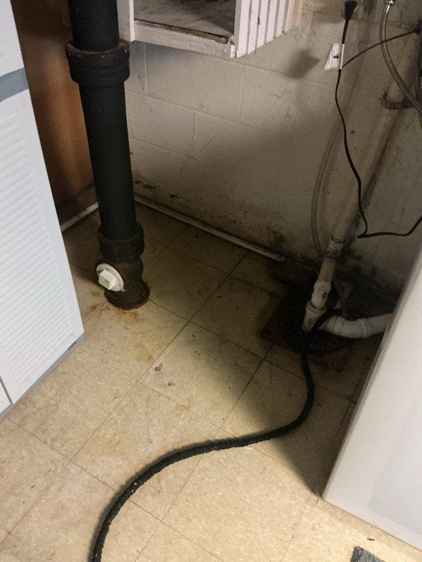 Responded to customer complaint of air conditioner not cooling adequately. Upon arrival, performed comprehensive system evaluation of 11-year-old outdoor condensing unit and 13-year-old furnace with air handler located in basement. Conducted visual inspection of exterior condenser unit, noting proper installation clearances and electrical disconnect box mounting. Inspected refrigerant line connections running along exterior wall and verified secure mounting brackets. Evaluated condensing unit for debris accumulation, fin condition, and proper pad placement. Proceeded to basement to assess indoor air handling equipment and associated ductwork. Examined furnace installation, inspecting surrounding utility connections including plumbing lines and electrical service. Verified system operational status and documented equipment age for maintenance planning purposes. Provided system assessment and discussed performance expectations for aging HVAC equipment with customer.