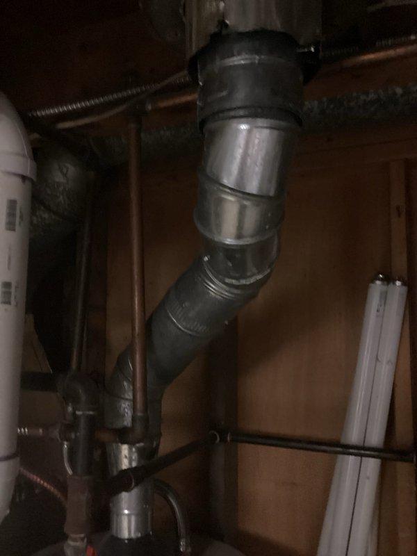 Completed comprehensive evaluation of existing HVAC system in basement utility area for air conditioning replacement estimate. Inspected current furnace unit with associated ductwork configuration, including gray flexible ductwork connections and white PVC condensate drainage system. Assessed existing infrastructure including metal supply ducts, return air pathways, and electrical conduit routing to determine compatibility with new AC installation. Documented equipment layout, clearance requirements, and existing piping arrangements to provide accurate replacement specifications for new air conditioning system that will integrate with current heating equipment.