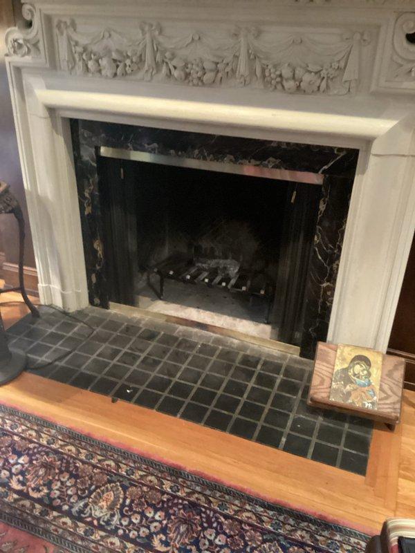 Provided estimate for installation of gas line to supply decorative fireplace. Assessed existing gas infrastructure in basement/crawlspace area beneath kitchen cabinetry and determined routing path to reach fireplace location in main living area. Proposed gas line installation would require running black iron pipe from existing gas supply through floor joists to terminate at fireplace with appropriate shutoff valve and connection for gas log set.