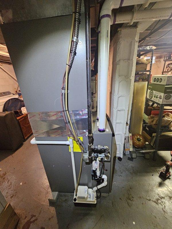 Installed a 96% efficiency upflow furnace rated at 90,000 BTU in basement location. Replaced approximately 20 feet of 2-inch PVC venting system with proper pitch and termination. Installed metal spacer to ensure proper clearances and code compliance. Connected 120-volt condensate pump to handle moisture removal from high-efficiency system. Replaced damaged supply register in existing ductwork to restore proper airflow. Mounted and programmed Honeywell digital thermostat for system control. Integrated Aprilaire humidifier with new furnace installation. Verified all electrical connections, gas line integrity, and proper combustion air supply. Tested system operation through complete heating cycle, confirmed proper ignition sequence, and validated safety controls. All work performed to manufacturer specifications and local building codes.
