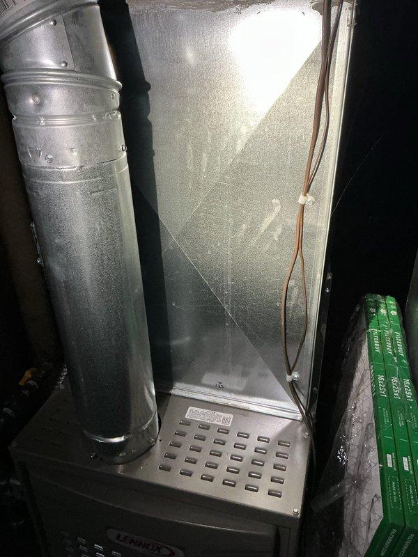 Responded to no cooling complaint on 22-year-old residential air conditioning system. Performed on-call diagnostic evaluation of existing Lennox HVAC equipment located in basement mechanical room. Assessed overall system condition, noting age of equipment and current operational status. Customer expressed interest in replacement system but requested temporary solution to maintain cooling through weekend due to high temperatures and medical oxygen equipment in home.