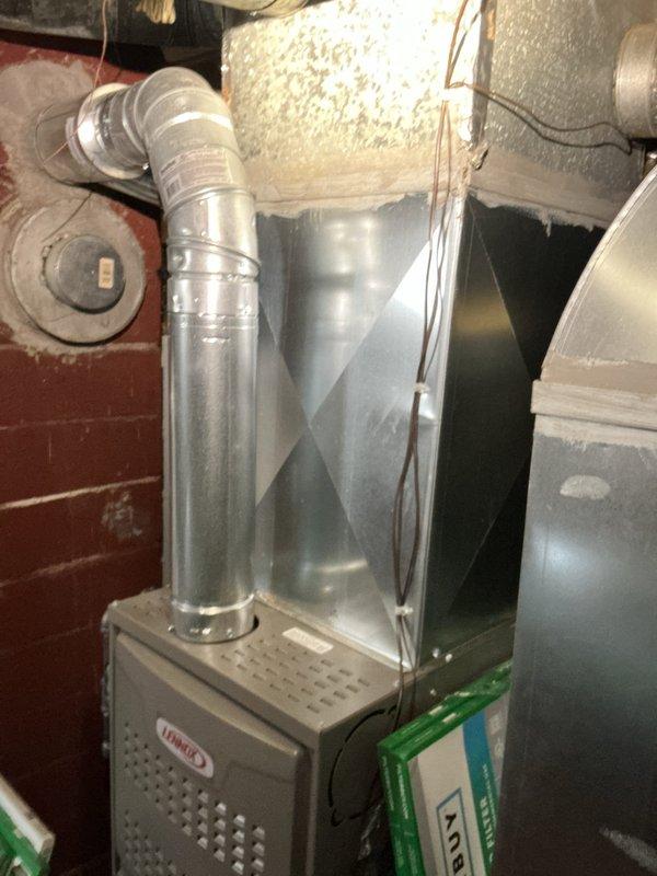 Responded to no cooling complaint on 22-year-old residential air conditioning system. Performed on-call diagnostic evaluation of existing Lennox HVAC equipment located in basement mechanical room. Assessed overall system condition, noting age of equipment and current operational status. Customer expressed interest in replacement system but requested temporary solution to maintain cooling through weekend due to high temperatures and medical oxygen equipment in home.