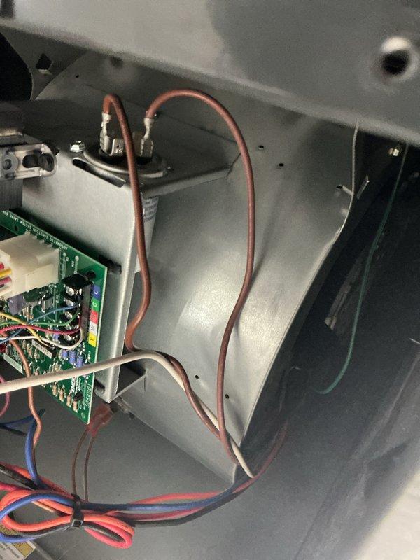 Performed scheduled heating maintenance on 10-year-old system. Inspected control board and electrical connections, verified all wire terminations secure and free of damage. Measured and recorded system voltage at 70.8V using calibration-grade multimeter. All components operating within normal parameters, no deficiencies noted.