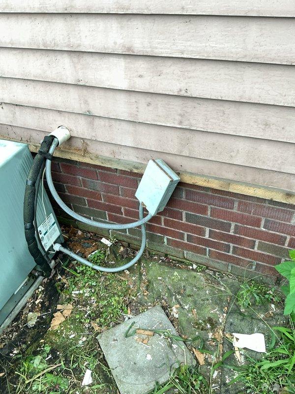 Responded to no cooling call for 20-year-old residential air conditioning system. Upon arrival, performed complete system diagnostic on outdoor condensing unit. Found unit experiencing complete failure due to age-related component degradation. Discussed system condition and available options with homeowner given the advanced age of equipment. Documented unit condition with photos showing weathered outdoor condenser with significant surface deterioration and surrounding area maintenance needs.