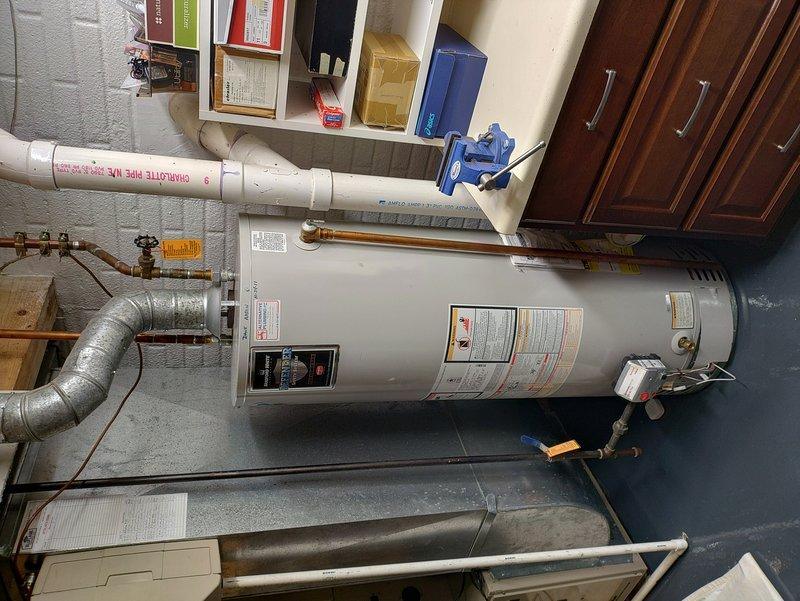 Performed scheduled maintenance inspection on 6-year-old gas furnace system. Confirmed unit operational status during the 8:00-8:30 AM service window, verified all heating components functioning properly, and documented equipment condition with photographic records of the mechanical room installation including water heater, gas connections, and associated HVAC infrastructure.