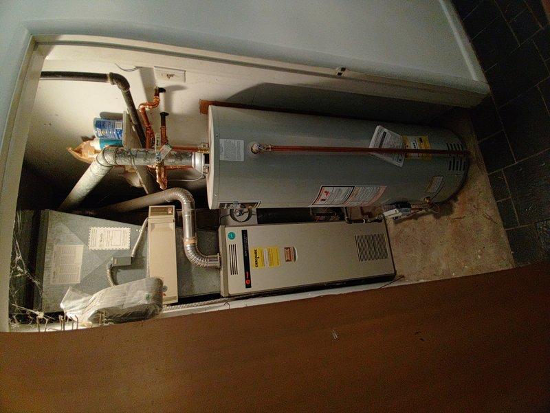 Completed comprehensive tune-up on 20+ year old outdoor air conditioning condenser unit. System inspection revealed aged equipment with weathered exterior components; performed standard maintenance including cleaning condenser coils, checking refrigerant levels, testing electrical connections at disconnect box, and verifying proper operation. Customer reported AC cooling only half the house, which may indicate ductwork issues or zoning problems requiring separate evaluation beyond this tune-up service.