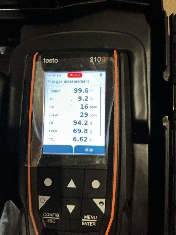 Completed comprehensive maintenance service on a 2-year-old gas furnace system. Performed combustion analysis using calibrated flue gas analyzer, confirming system efficiency at 94.2% with oxygen levels at 9.2%, carbon monoxide reading of 16 ppm in flue gas (29 ppm air-free), and stack temperature of 99.6°F. Inspected PVC vent pipe installation and verified proper sealing at boot connection with secure clamp attachment through insulated area. All measurements within acceptable parameters for natural gas appliance operation.