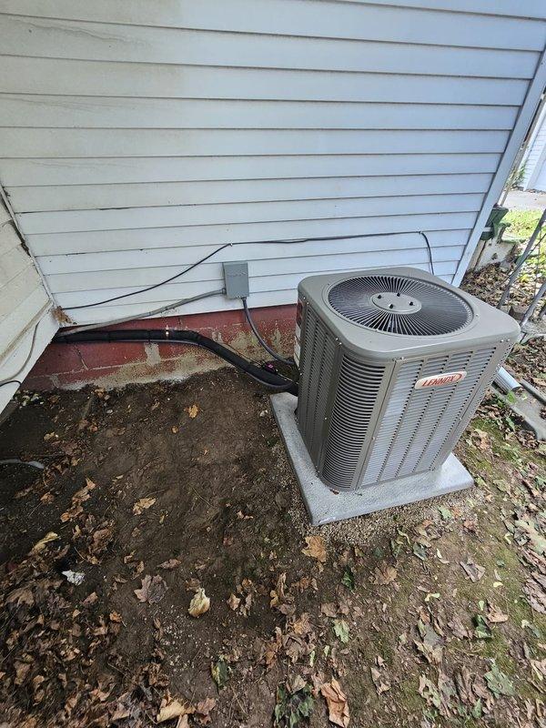 Completed full HVAC system installation including a 2-ton air conditioning condenser unit mounted on a new concrete ground pad with 30-amp disconnect box and electrical conduit properly installed per code. Installed Lennox 80% upflow furnace in basement with B cabinet configuration, paired with uncased 2-ton evaporator coil and connected with 20-foot lineset. Installed new thermostat, ran all necessary ductwork connections, and completed all electrical hookups. System tested and verified operational with proper airflow and refrigerant charge confirmed.