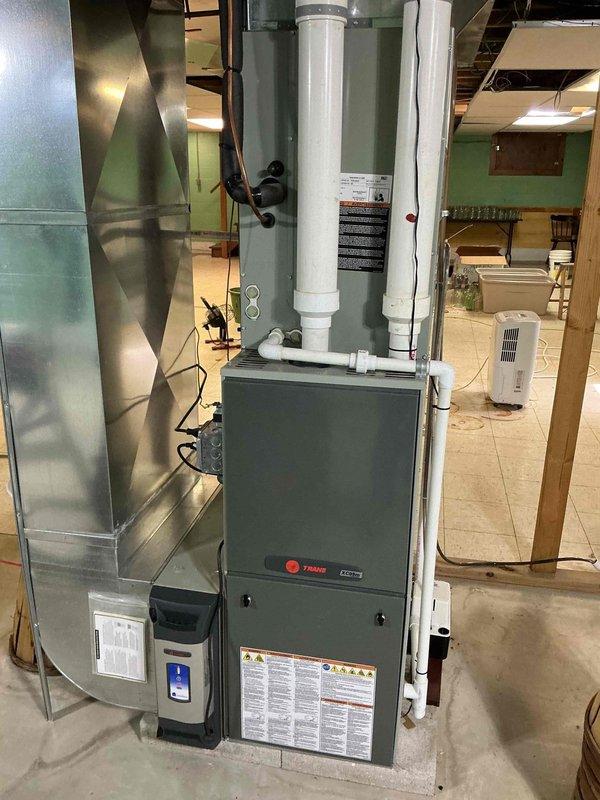 Completed comprehensive heating maintenance on Trane gas furnace system. Performed full system inspection including burner assembly, heat exchanger, blower motor, gas valve controls, and electrical components. Verified proper operation of intake and exhaust PVC venting, tested all safety controls, and confirmed efficient combustion. System operating within manufacturer specifications with all components functioning properly.