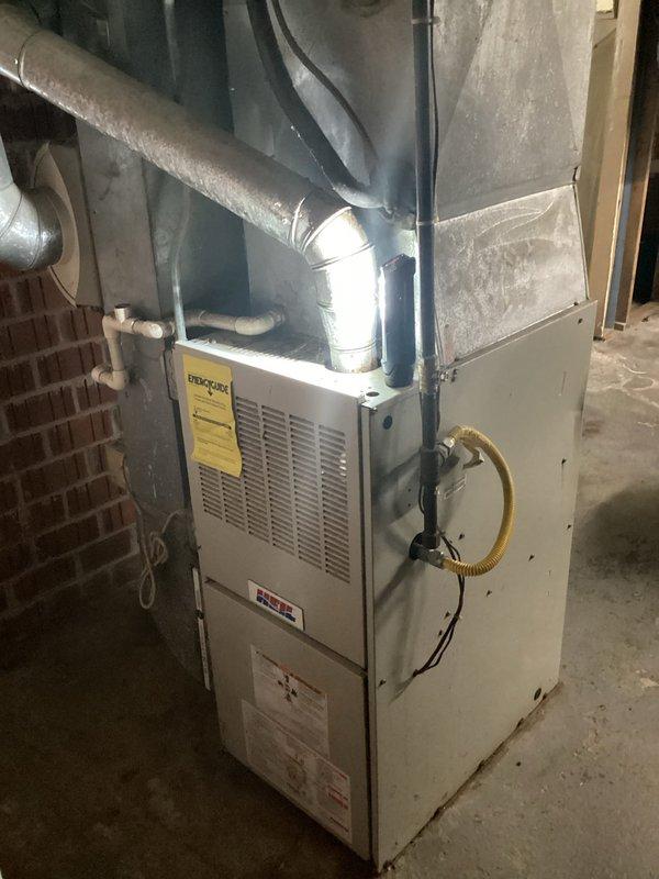 Conducted comprehensive assessment of existing residential HVAC system for complete replacement. Evaluated outdoor condensing unit positioned on concrete pad adjacent to home exterior and indoor furnace installation in basement utility area. Documented current equipment specifications, ductwork configuration, gas line connections, and electrical service. Provided detailed estimate for replacement of both heating and cooling systems with appropriate equipment sizing and installation requirements.