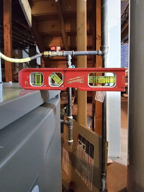 Installed upflow 110,000 BTU furnace with metal spacer fabricated and fitted to ensure proper clearances and alignment. Completed all gas piping connections and electrical hookups per code, installed 50-gallon Bradford White water heater, and mounted new thermostat with system testing to verify proper operation of all equipment.
