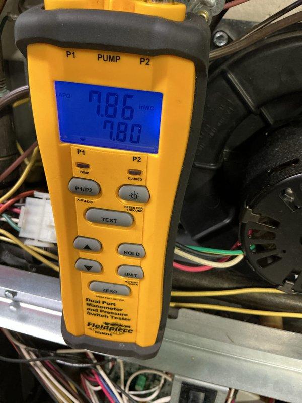 Completed comprehensive maintenance service on a 22-year-old gas-fired furnace. Performed thorough inspection of all internal components including gas valve assembly, ignition control module, burner assembly, and electrical connections. Verified proper operation of all colored wire connections (red, blue, black, and yellow) to control board and safety devices. Conducted pressure switch diagnostic testing using digital manometer, recording inlet and outlet pressure readings of 786 and 780 IWG respectively to confirm proper draft inducer motor operation and venting performance. Inspected gas valve terminals and connections for secure mounting and proper electrical continuity. Verified all safety controls, including flame sensor and limit switches, are functioning within manufacturer specifications. All components found to be operating correctly with no immediate repairs required. Unit tested and left in safe operating condition.