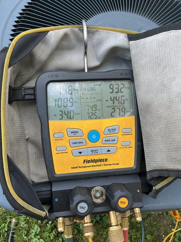 Responded to no cooling complaint at residential property. Upon arrival, connected refrigerant manifold gauges to outdoor condensing unit to diagnose system operation. Performed pressure and temperature readings on refrigerant circuit to assess system charge and operational status. Gauges indicated abnormal readings requiring further evaluation of refrigerant levels and system performance. Conducted diagnostic testing to determine root cause of cooling failure and identify necessary repairs to restore proper air conditioning function.