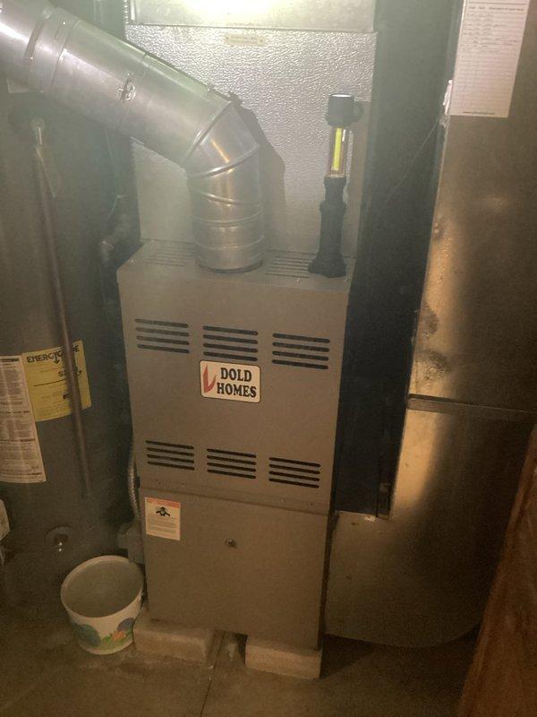 Completed comprehensive HVAC system evaluation for full equipment replacement. Assessed existing indoor furnace unit located in basement utility area and outdoor cylindrical condenser unit positioned on exterior concrete pad. Documented current system configuration including ductwork connections, electrical disconnect, and overall installation conditions to provide accurate replacement specifications and equipment recommendations.