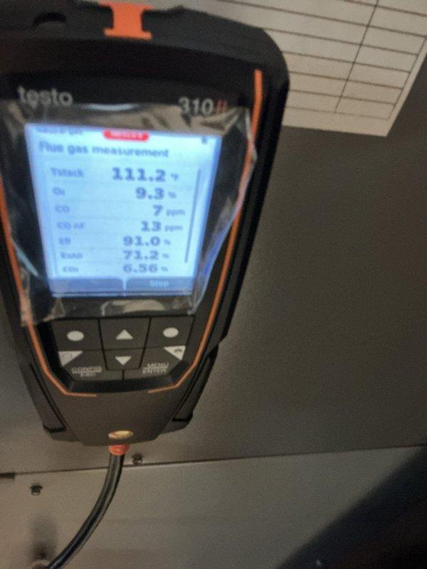 Completed annual heating maintenance on a 10-year-old unit. Performed combustion analysis using Testo 310 analyzer, confirming proper operation with flue gas temperature at 111.2°F, oxygen at 9.6%, carbon monoxide at 7 ppm, and CO2 at 13 ppm—all readings within acceptable parameters. Inspected and documented system components including ceiling-mounted equipment and safety devices.
