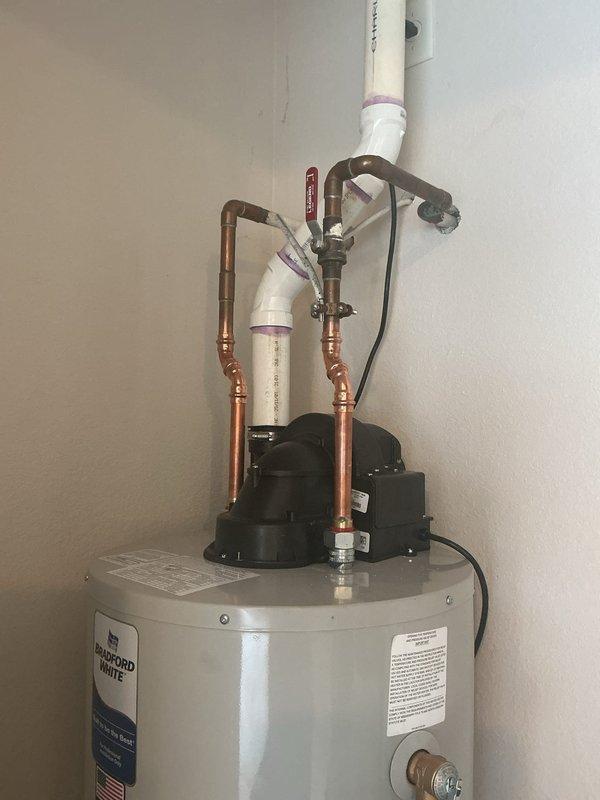 Replaced water heater per inspection report requirements and addressed multiple plumbing leaks throughout the residence. Installed new Bradford White tanked water heater with recirculation pump system, including copper supply piping, brass fittings, PVC vent piping, temperature/pressure relief valve, and electronic control unit with wall-mounted controller. Completed all connections to existing plumbing infrastructure and verified system operation upon installation.