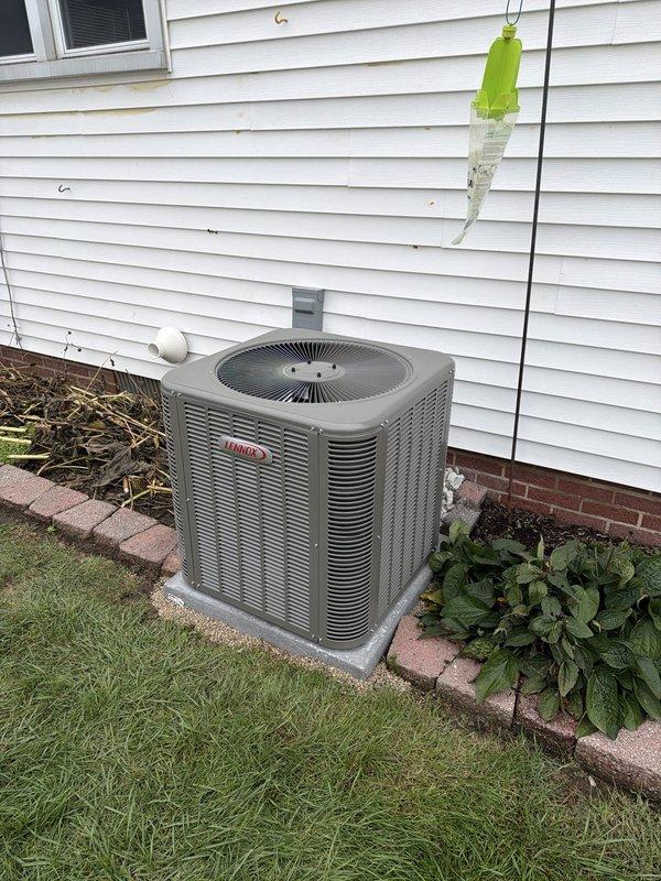 Completed full HVAC system installation including new single-stage air conditioning condenser unit and matching evaporator coil in a space-constrained indoor mechanical closet with only 20.5 inches of clearance. Fabricated custom plenum and access door to accommodate uncased coil configuration, installed 50 feet of 3/4-3/8 refrigerant lineset connecting outdoor condenser to indoor coil, and set new condenser on concrete pad with stone base. Installed new electrical disconnect and whip for outdoor unit, reused existing thermostat, and ensured all refrigerant connections, drainage lines, and electrical components were properly secured and tested for optimal system operation.