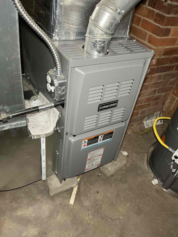 Completed comprehensive MVP heating maintenance on Concord brand natural gas furnace for new homeowner. Performed full system inspection and combustion analysis using Testo flue gas analyzer, which revealed stack temperature of 418.1°F, oxygen level at 7.6%, carbon monoxide at 31 ppm, air-free CO at 49 ppm, combustion efficiency at 79.4%, excess air at 50.8%, and CO2 at 7.52%. All combustion readings fell within acceptable operating parameters for natural gas equipment. Verified furnace operation, inspected electrical connections at junction box, examined flexible ductwork connections, and confirmed proper venting. No air conditioning system was found on the property during inspection.