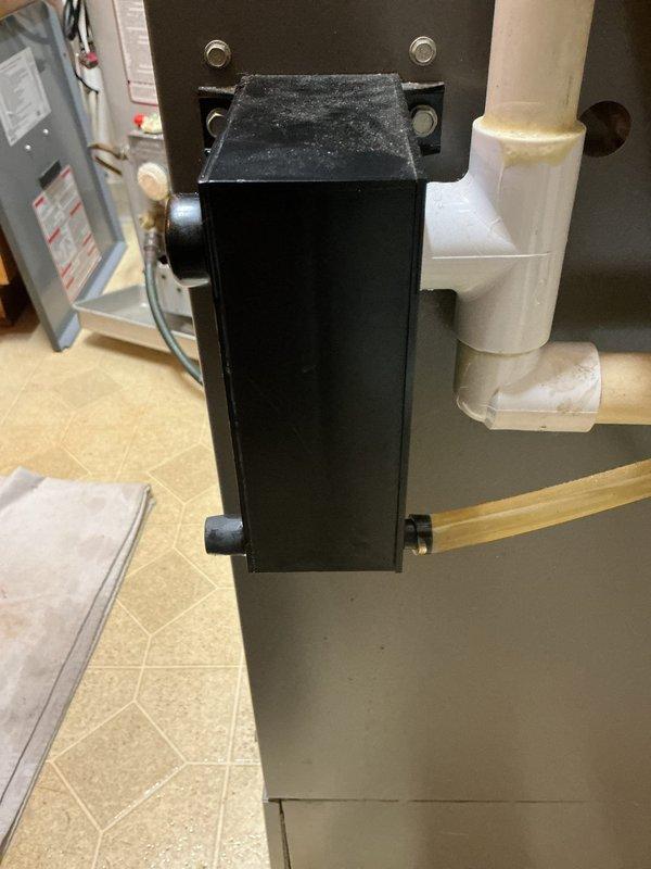 Completed preventive maintenance on 19-year-old air conditioning system. System requires air filter replacement, filter number 66783 noted for future service. Inspected condensate pump assembly and drainage system, both operating properly with PVC piping and trap configuration in good condition.