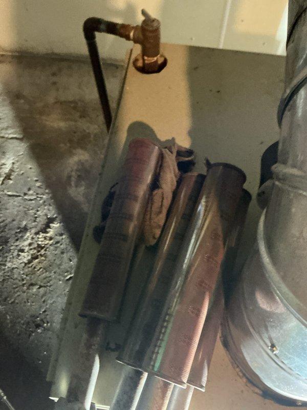 Completed annual maintenance on 20+ year old boiler system. Performed comprehensive inspection of heating components, burner assembly, and associated piping systems. Noted significant corrosion and oxidation on copper supply lines and threaded fittings, particularly at connection points, with visible verdigris patina indicating age-related deterioration. Documented moisture staining on basement floor and assessed overall system condition. Cleaned and serviced boiler components, verified proper operation of all safety controls, and confirmed system functionality for upcoming heating season.