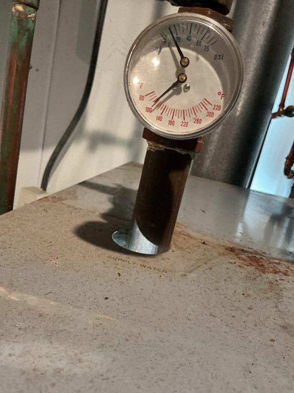 Performed routine maintenance on a 20+ year old residential boiler system. Inspected pressure gauge readings, verified proper operating pressures and temperatures, examined all piping connections and fittings for leaks or corrosion, and assessed the expansion tank and associated copper plumbing. All components were found to be functioning within normal parameters and the system was left in safe operating condition.