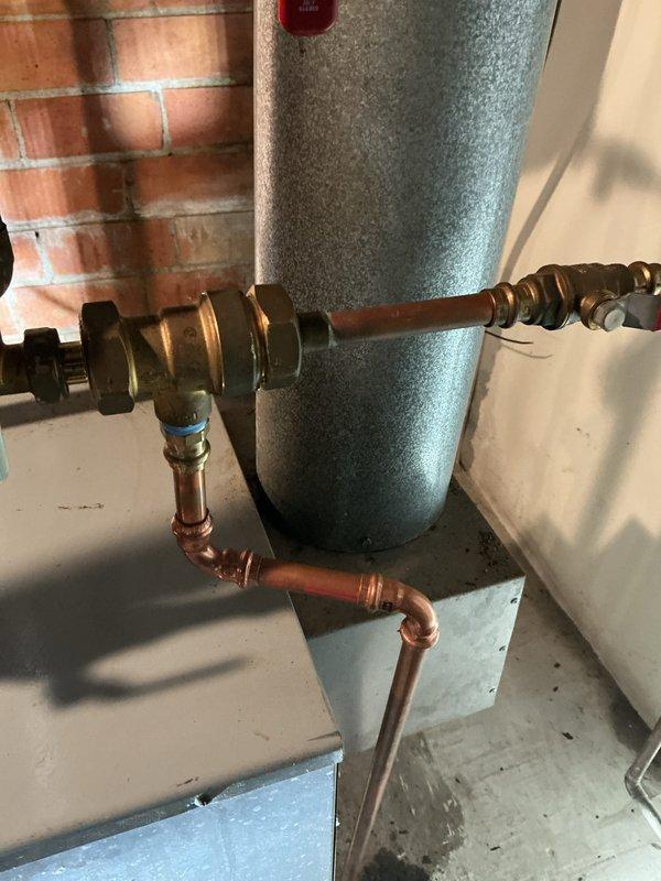 Performed routine maintenance on a 20+ year old residential boiler system. Inspected pressure gauge readings, verified proper operating pressures and temperatures, examined all piping connections and fittings for leaks or corrosion, and assessed the expansion tank and associated copper plumbing. All components were found to be functioning within normal parameters and the system was left in safe operating condition.