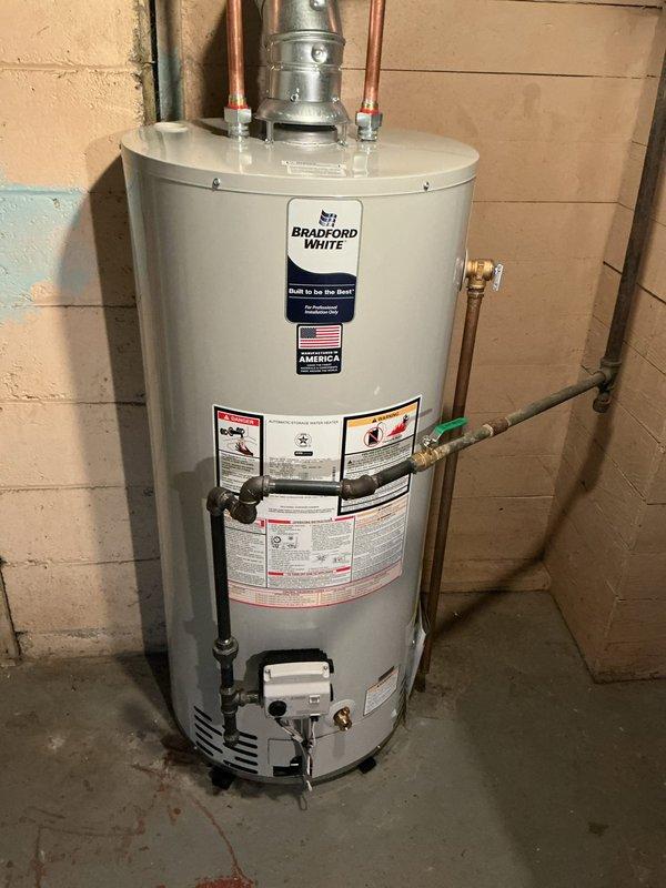 Sold and installed a 40-gallon natural draft short Bradford White water heater to replace the existing unit. Verified proper installation with level plumb, connected copper water lines and gas supply with appropriate shut-off valve, and ensured proper venting configuration with galvanized flue pipe.