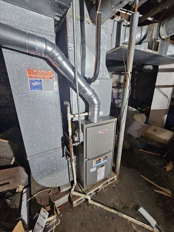 Installed Lennox ML180 upflow furnace with 90,000 BTU capacity in basement utility area. Completed all metal gas line connections, electrical hookups, and ductwork integration with existing HVAC system. Installed new thermostat and verified proper leveling and operation of unit upon startup.