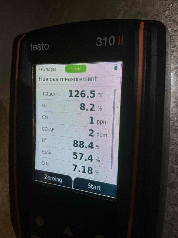 Completed comprehensive tune-up on 24-year-old Lennox furnace located in basement. Performed combustion analysis using Testo 310 II analyzer, confirming system operating within acceptable parameters with flue temperature at 126.5°F, oxygen level at 8.2%, carbon monoxide at 1 ppm (2 ppm air-free), and combustion efficiency at 88.4%. Inspected all major components including heat exchanger, burner assembly, blower motor, and integrated humidifier system. Verified proper venting through PVC exhaust system and confirmed all safety controls operational. System running safely and efficiently with no immediate concerns noted, though age of unit warrants monitoring for future replacement consideration.