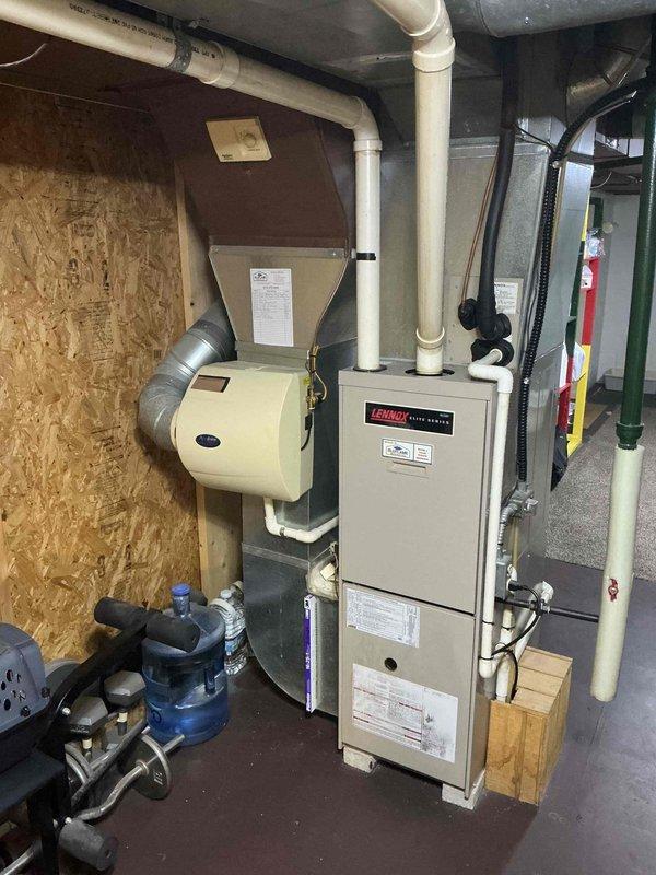 Completed comprehensive tune-up on 24-year-old Lennox furnace located in basement. Performed combustion analysis using Testo 310 II analyzer, confirming system operating within acceptable parameters with flue temperature at 126.5°F, oxygen level at 8.2%, carbon monoxide at 1 ppm (2 ppm air-free), and combustion efficiency at 88.4%. Inspected all major components including heat exchanger, burner assembly, blower motor, and integrated humidifier system. Verified proper venting through PVC exhaust system and confirmed all safety controls operational. System running safely and efficiently with no immediate concerns noted, though age of unit warrants monitoring for future replacement consideration.