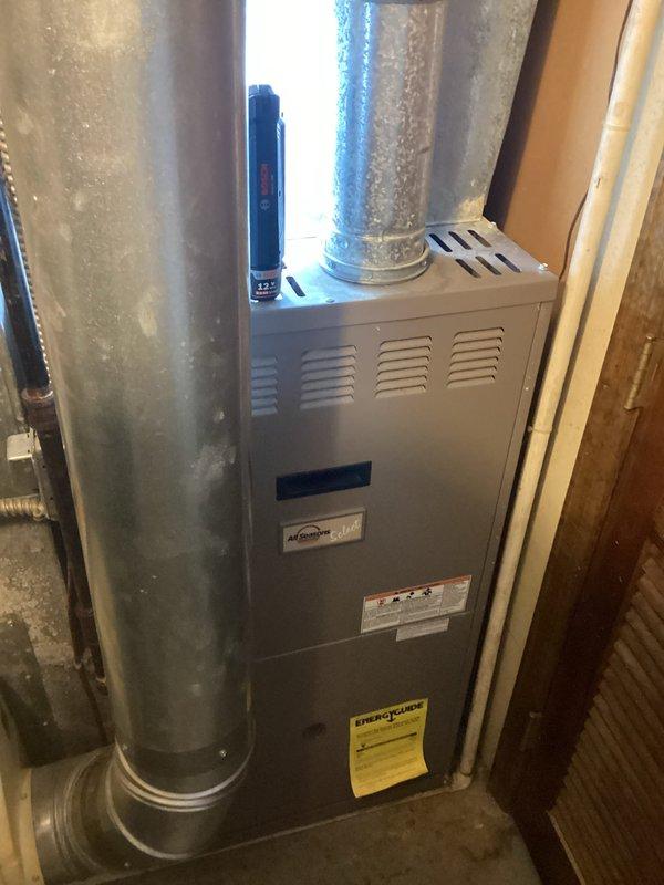Completed comprehensive assessment of existing HVAC furnace system for replacement estimate. Evaluated current furnace unit, associated ductwork including horizontal galvanized metal supply plenum, and air handler configuration in mechanical room. Documented equipment condition, existing installation setup with reflective insulation backing, and verified system specifications. Photographed equipment labels and manufacturer information to provide accurate replacement recommendations and ensure proper sizing for new furnace installation.