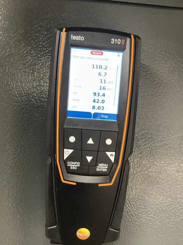 Performed comprehensive air conditioning tune-up on 5-year-old system experiencing intermittent 30A fuse failures. Conducted flue gas analysis using Testo 310 II combustion analyzer, recording multiple parameters including temperature, oxygen levels, and carbon monoxide readings to verify safe operation. Inspected interior components, wiring connections, and circuit board for signs of electrical stress or thermal damage. Observed discoloration on insulation material within unit compartment, indicating possible previous overheating or moisture intrusion. Verified all wire connections are secure with proper strain relief, checked control board functionality, and confirmed no active heating or cooling function loss at time of service. System operating within normal parameters following inspection and preventive maintenance procedures.