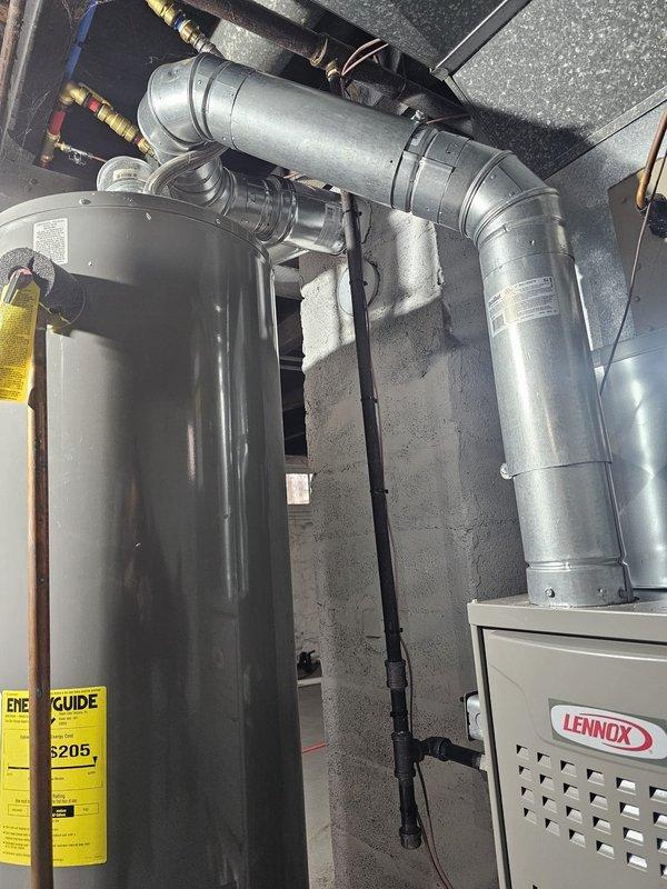Completed installation of Lennox upflow gas furnace rated at 80% AFUE and 45,000 BTU capacity in basement utility area. Installation included metal 12-gallon humidifier, 5-inch filter rack, 120V condensate pump with discharge piping, new dedicated electrical wiring, and WiFi-enabled thermostat. All ductwork connections, gas piping, venting, and electrical terminations completed per manufacturer specifications and local code requirements, with system tested and operational upon completion.