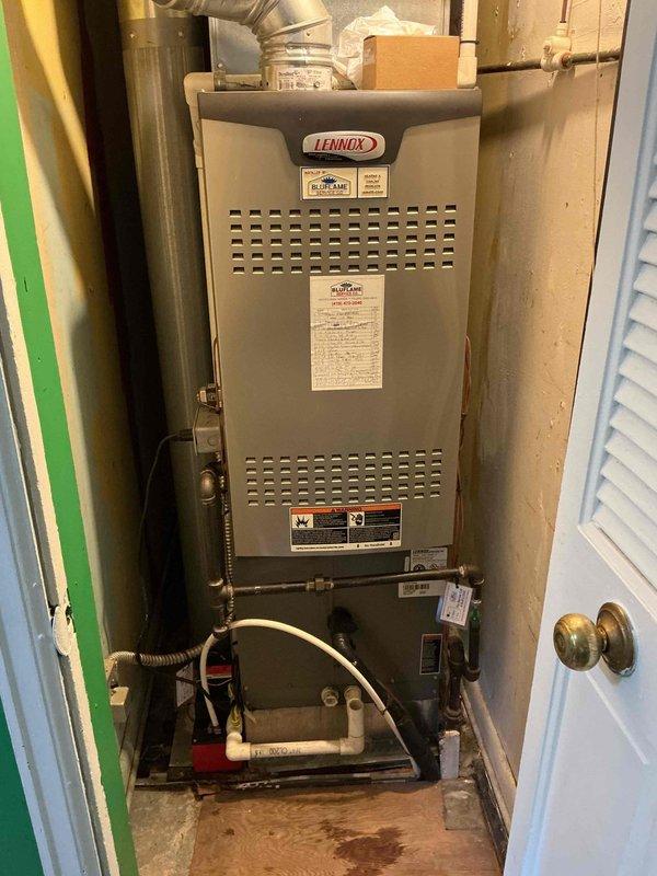 Performed scheduled maintenance on a 14-year-old Lennox gas furnace located in a utility closet. Completed standard tune-up procedures including inspection of burner assembly, heat exchanger, blower motor, and all safety controls. Verified proper operation of the Aprilaire humidifier integrated with the system. Checked gas connections and shutoff valves for leaks, inspected venting and ductwork connections, and tested condensate pump operation. All components found to be functioning within normal parameters and system operating safely.