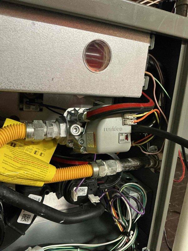 Performed comprehensive tune-up on 2-year-old residential gas furnace system. Conducted visual inspection of internal components including gas valve assembly, CSST flexible gas line connections, blower motor assembly, and all electrical connections. Verified proper operation of all safety controls, confirmed secure wire terminations, and documented equipment condition through photographic documentation.