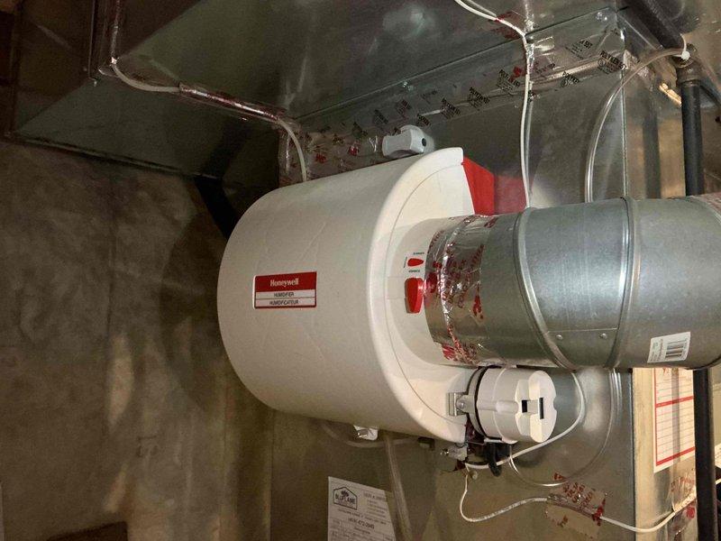 Completed scheduled maintenance tune-up on a 2-year-old residential gas furnace system with integrated humidifier. Performed comprehensive inspection of all components, verified proper operation of heating system and humidification equipment, checked ductwork connections, and confirmed system is functioning within manufacturer specifications.