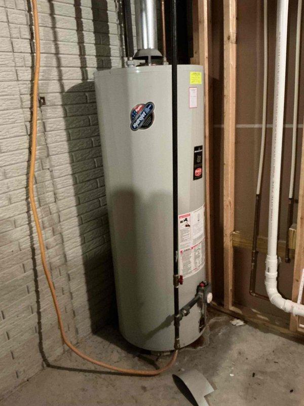 Provided estimate for replacement of existing natural gas water heater with new 65-gallon, 65,000 BTU unit. Inspected current water heater installation in basement utility area, noting standard venting configuration with PVC and metallic ductwork, copper and PVC supply lines, and gas connection at base of unit. Documented existing equipment specifications and installation conditions to prepare accurate replacement proposal.