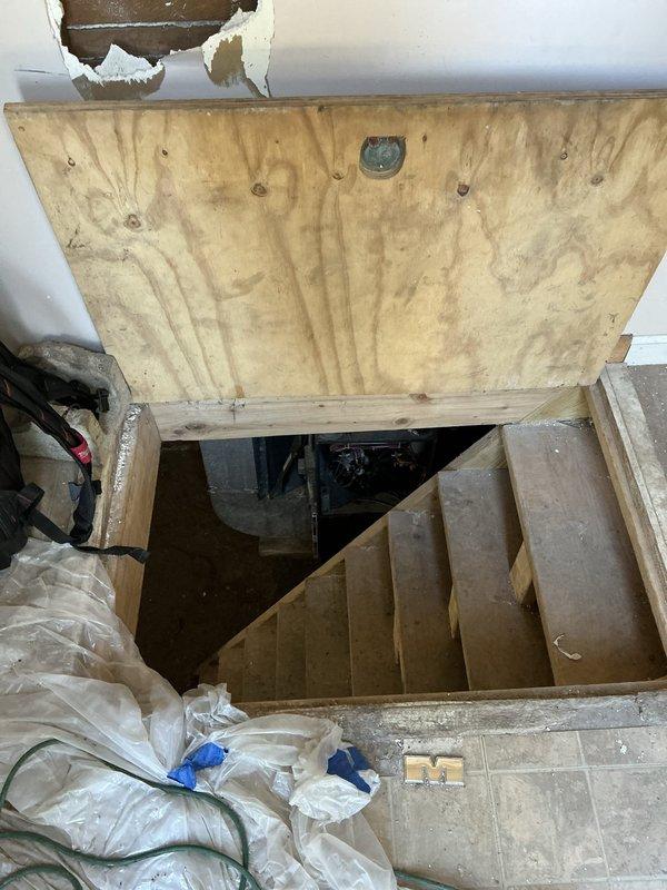 Responded to no-heat call on 20-year-old gas furnace. Upon arrival, accessed unit located in basement area. Performed diagnostic evaluation of furnace system and associated components. Inspected burner assembly, heat exchanger, blower motor, and electrical connections mounted on exterior brick wall foundation. Documented equipment condition showing significant age-related deterioration including paint oxidation, surface corrosion, and general wear on cabinet and mounting hardware. Identified failed component preventing ignition sequence. Completed necessary repairs to restore heating operation and verified proper system function before departure.