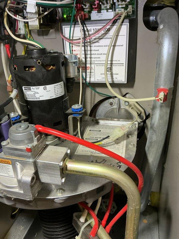 Completed scheduled heating maintenance on 20+ year old boiler system during requested morning timeframe. Performed comprehensive inspection of boiler components including motor assembly, gas valve, ignition system, and electrical connections; verified proper operation of circulator pump and hydronic piping connections. System operational upon completion, though advanced age and visible exterior corrosion noted for future consideration.