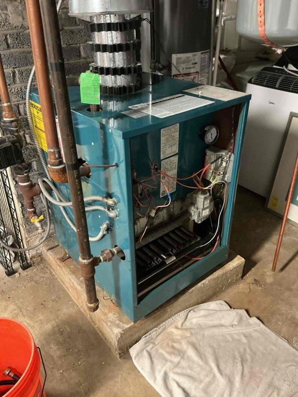 Performed annual maintenance on 15-year-old residential boiler system. Completed comprehensive inspection of burner assembly, heat exchanger, and all internal components with access panel opened for thorough evaluation. Verified proper operation of expansion tank, checked system pressures, and inspected all copper piping connections for leaks or corrosion.