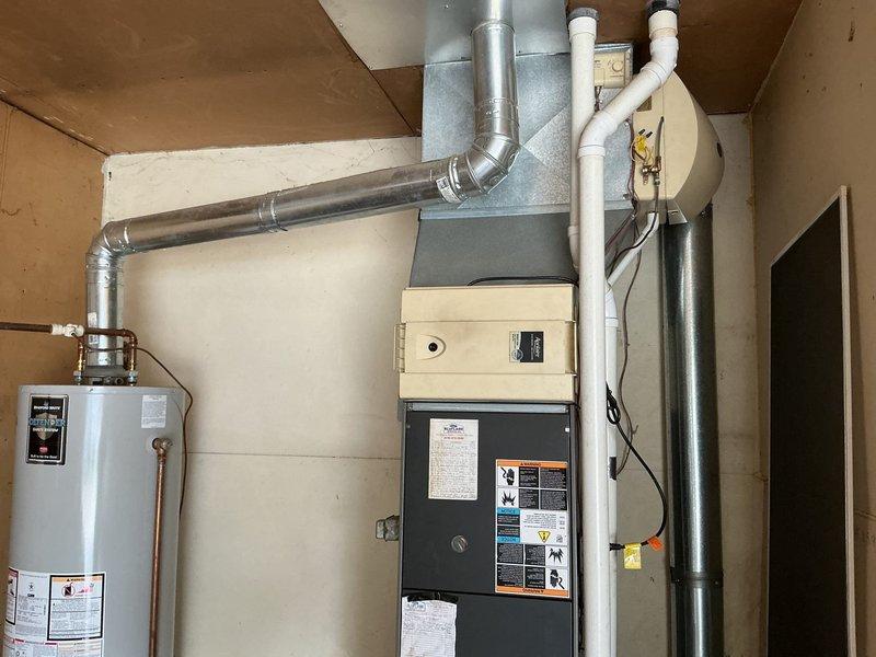 Completed comprehensive winter furnace maintenance and tune-up on residential heating system. Performed full system inspection, including examination of heat exchanger, burner assembly, and blower components. Documented evidence of historical condensate staining on furnace cabinet panels, indicating normal operational condensation drainage patterns over time. Verified all electrical connections, tested safety controls, and confirmed proper venting through PVC condensate system. System operating within manufacturer specifications with no immediate service concerns identified.