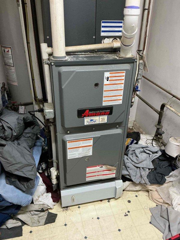 Completed comprehensive heating tune-up on 10-year-old Amana residential furnace system. Performed full system inspection including burner assembly cleaning, heat exchanger examination, blower motor lubrication, air filter evaluation, gas pressure testing, flue pipe inspection, and thermostat calibration verification. All components found operating within manufacturer specifications with no safety concerns identified; system returned to normal operation.
