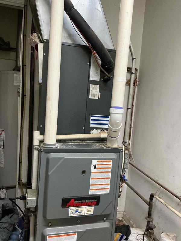 Completed comprehensive heating tune-up on 10-year-old Amana residential furnace system. Performed full system inspection including burner assembly cleaning, heat exchanger examination, blower motor lubrication, air filter evaluation, gas pressure testing, flue pipe inspection, and thermostat calibration verification. All components found operating within manufacturer specifications with no safety concerns identified; system returned to normal operation.