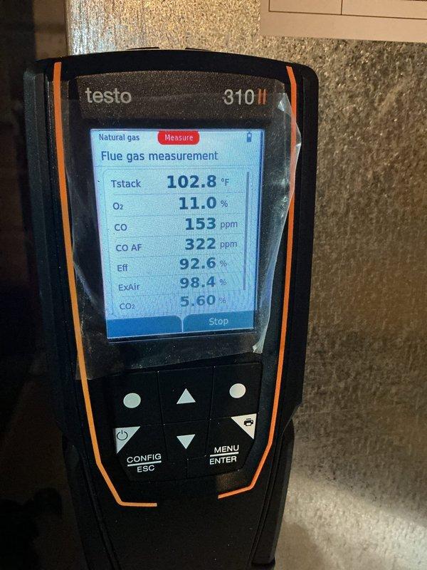 Completed annual heating maintenance on 15-year-old gas furnace system. Performed comprehensive combustion analysis using digital flue gas analyzer, recording stack temperature of 102.8°F, oxygen level of 11.0%, carbon monoxide reading of 153 ppm, and efficiency rating of 92.6%. Inspected exterior exhaust vent termination point on building exterior and verified proper clearances. System is approaching end of service life and customer advised to consider replacement options within the next 1-5 years due to age and efficiency considerations.