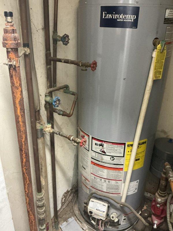 Responded to complaint of noisy pipes on steam boiler system at 120 SC location. Upon inspection, identified water hammer and thermal expansion issues in the steam piping distribution system connected to the gas-fired boiler. Documented existing conditions including aged copper piping with varying degrees of oxidation, multiple shut-off valves, and interconnected plumbing configuration serving both the heating system and domestic water heater. Recommended addressing pipe support and potential steam trap maintenance to eliminate noise concerns.