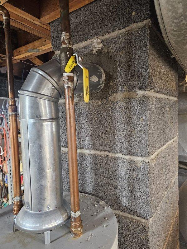 Completed installation of an upflow 80% efficiency signature furnace in basement utility area. Installed 5-inch filter rack, fabricated and installed required metal ductwork transitions, and established new gas and electrical connections to code. Mounted new Honeywell thermostat and verified proper system operation, ensuring level alignment of all equipment and ductwork components for optimal performance.