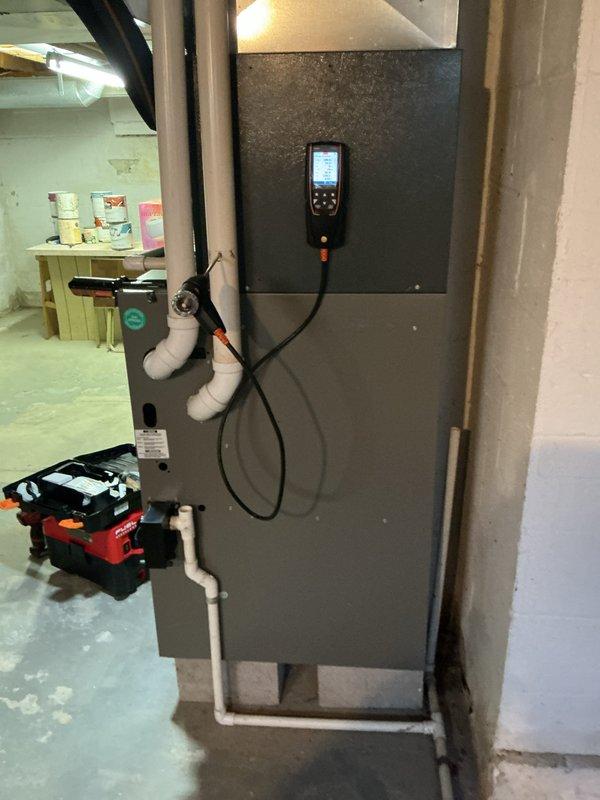 Performed comprehensive heating system tune-up on 20-year-old furnace unit located in basement. Conducted full system diagnostics including temperature differential measurements at supply registers, recording 111°F discharge air temperature, and performed electrical testing using digital multimeter to verify proper amperage draw and component operation. Completed routine maintenance checklist, inspected heat exchanger, burner assembly, and all safety controls to ensure system is operating safely and efficiently for the heating season.
