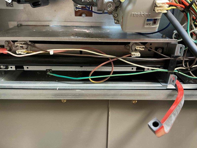 Responded to no heat call on recently installed furnace system with unresponsive thermostat. Upon inspection, discovered loose wiring connection at the furnace control board affecting the thermostat communication circuit. Secured all low-voltage wiring connections at the Resideo control module, verified proper 24V signal to thermostat, and tested system operation through multiple heating cycles. Furnace ignited properly and delivered heat as designed, with thermostat now responding correctly to temperature calls.